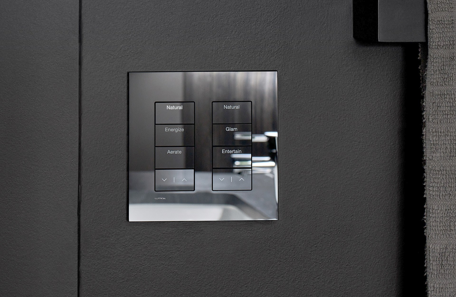 Lutron Palladiom keypad flush-mounted on a dark plaster wall